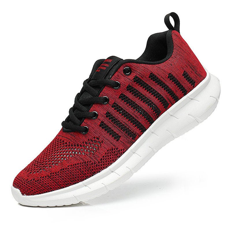 Red and black sneaker with white sole on a white background