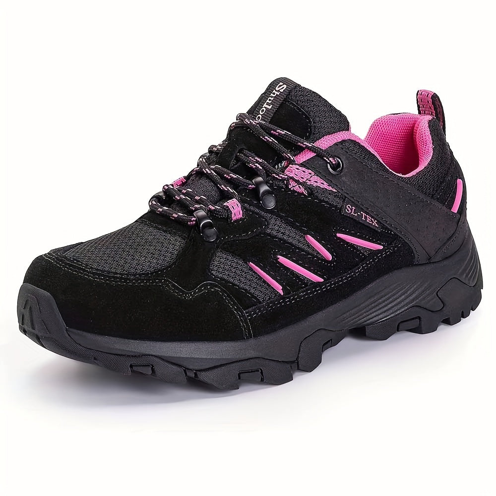 Black and pink women’s non-slip hiking shoes on a white background