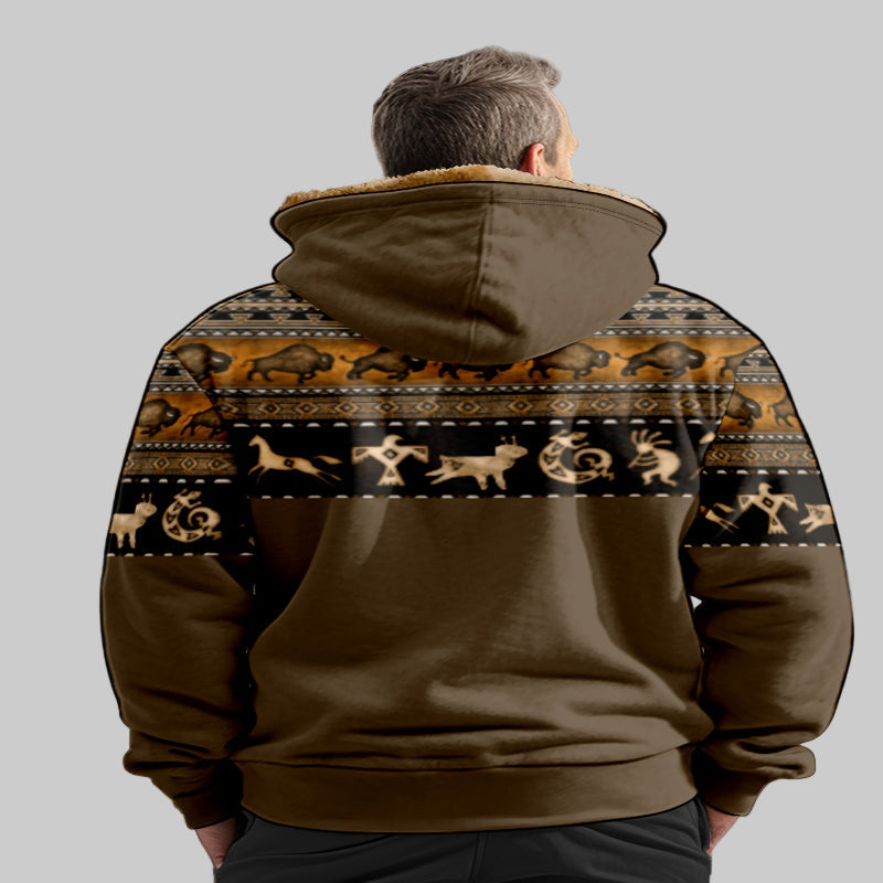 Person wearing a brown hoodie with a patterned back on a gray background