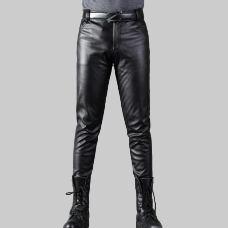 Black leather pants on a gray background with close-up of texture.