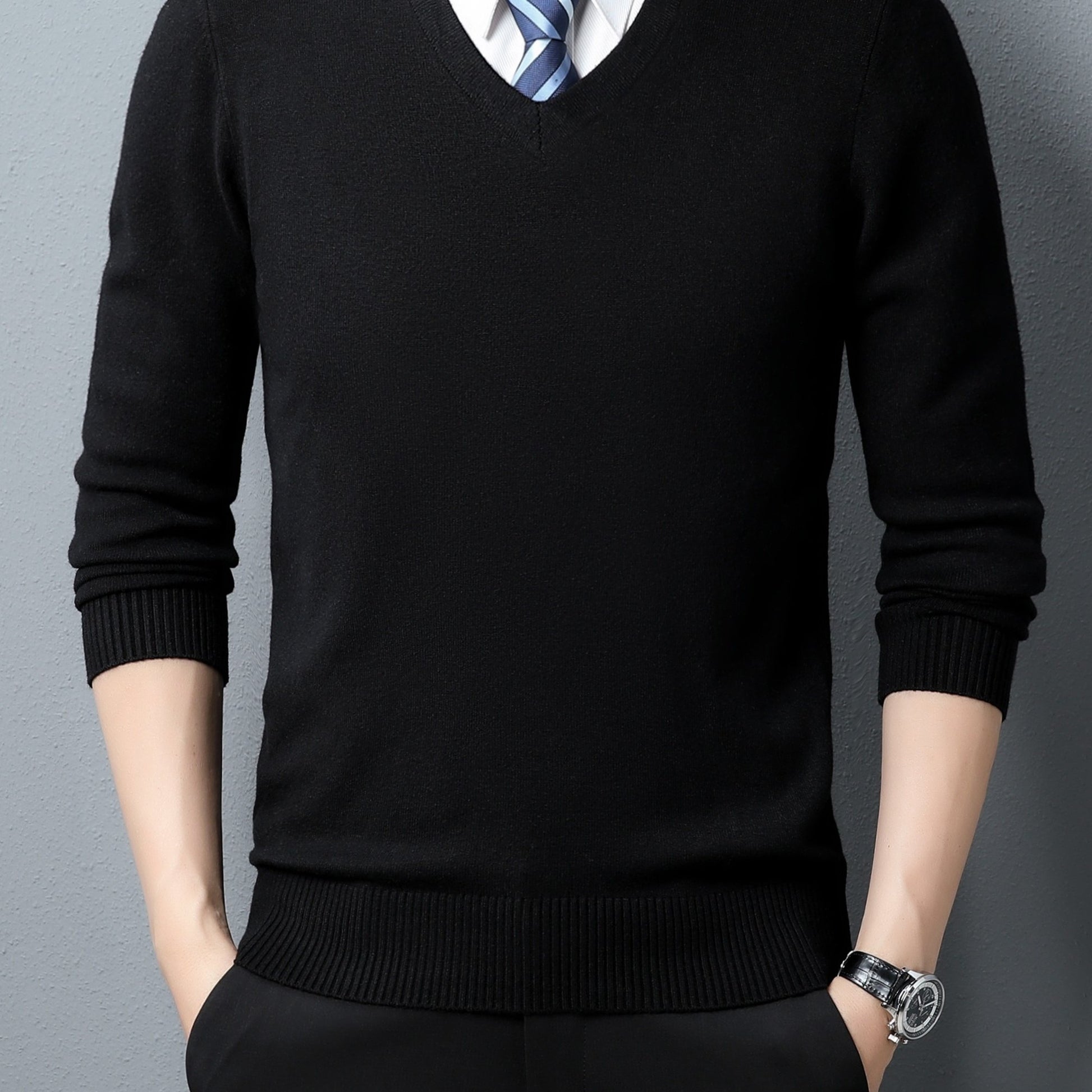 Black Men's Knitted V-neck Sweater worn by a person on a gray background