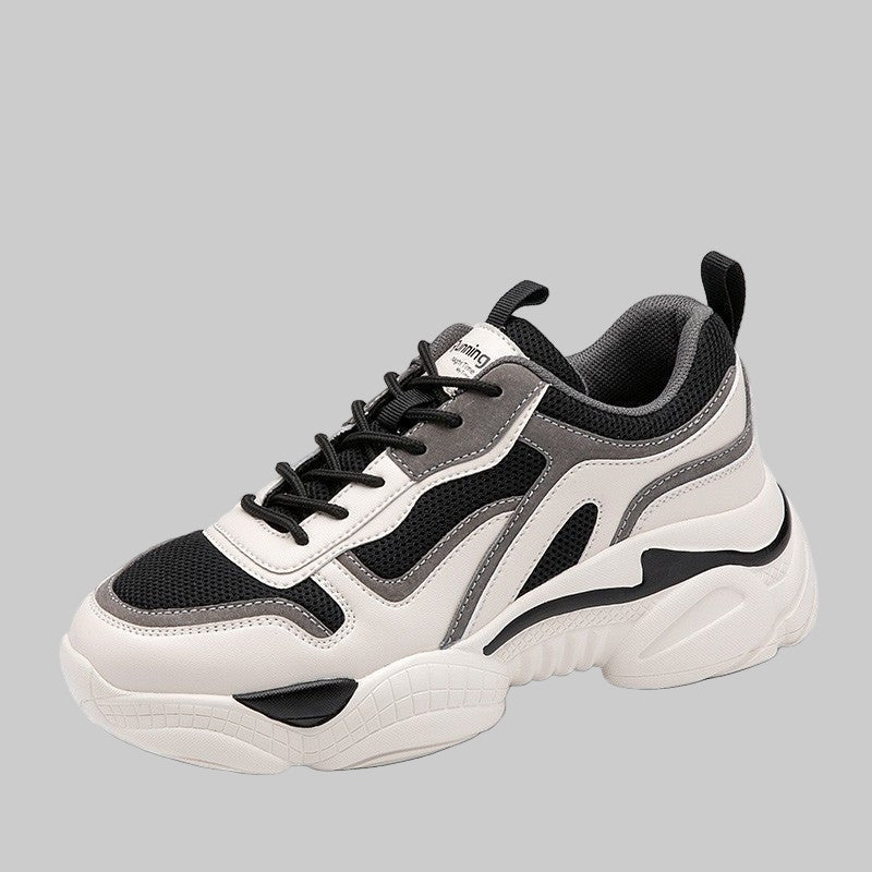 White and black sneaker with brand logo on a white background