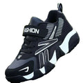 A pair of kids' sport sneakers with a black and white design, featuring a lace-up closure and the word 'FASHION' printed on the side.