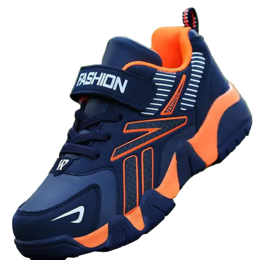 A pair of kids' sport sneakers with a black and white design, featuring a lace-up closure and the word 'FASHION' printed on the side.