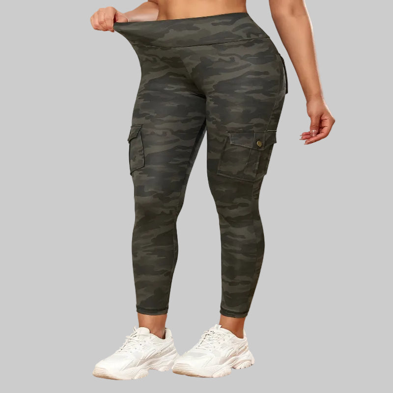 Person wearing camouflage cargo leggings with a neutral background