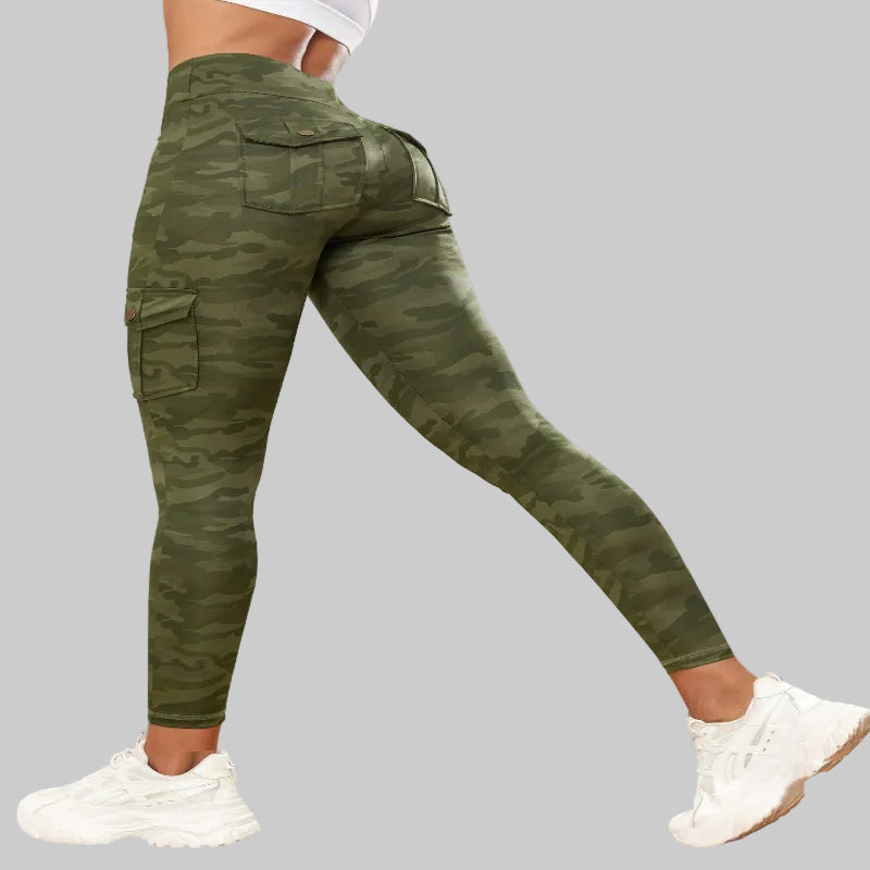 Green camouflage pants worn by a person indoors.