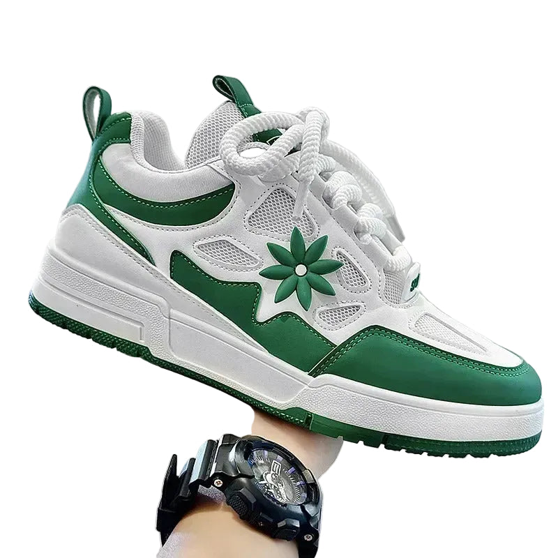 Green and white sneaker with floral design on a neutral background