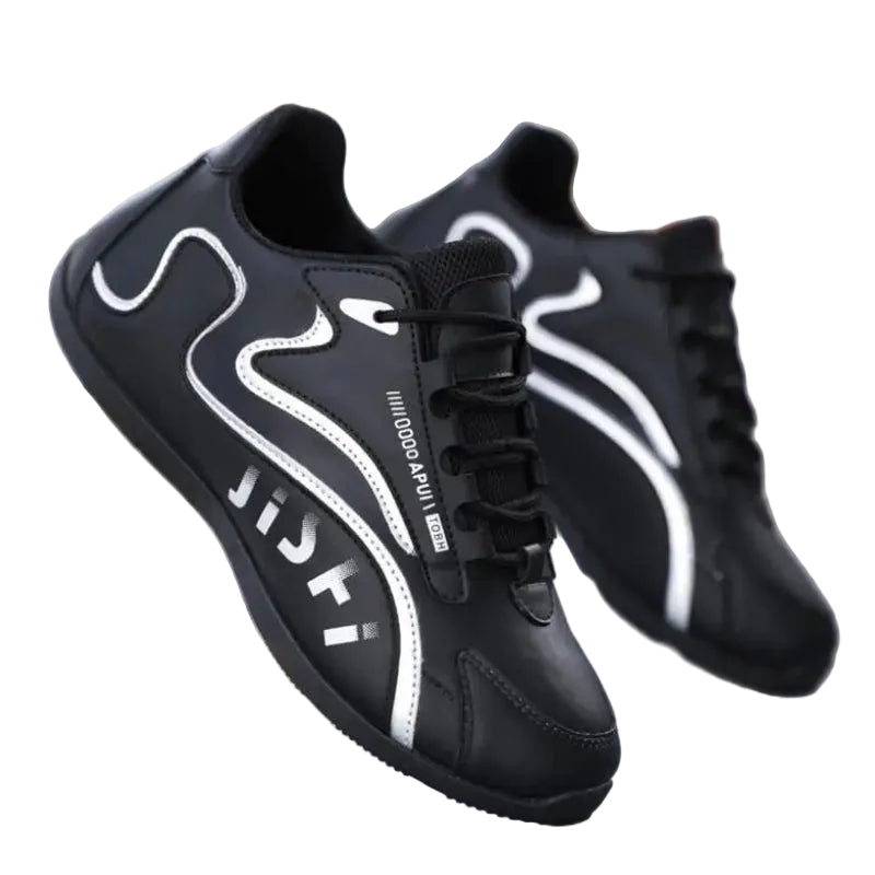 Black sneakers with white designs on a blurred background