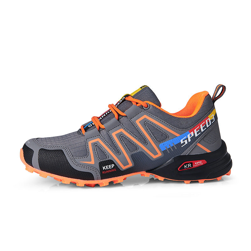 Gray and orange athletic shoe with 'Speed' branding on a white background