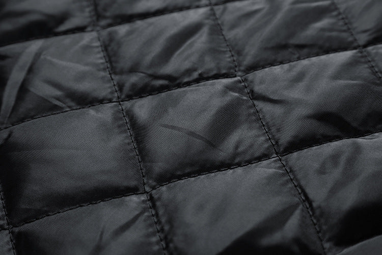Close-up of black quilted fabric texture