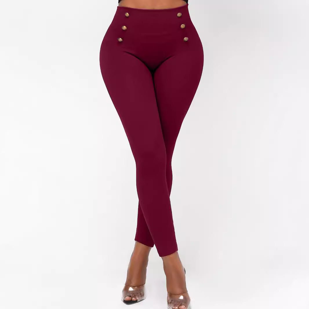 Maroon High Waisted Pants for Women with button details on a white background