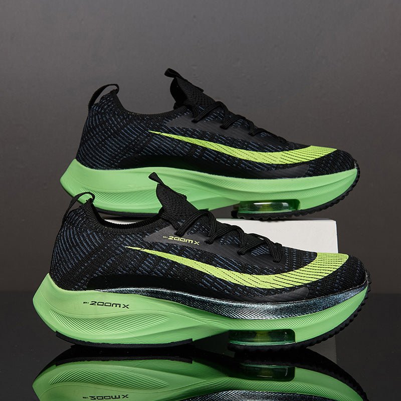 Black and green running shoes with 'Zoom X' branding on a reflective surface.