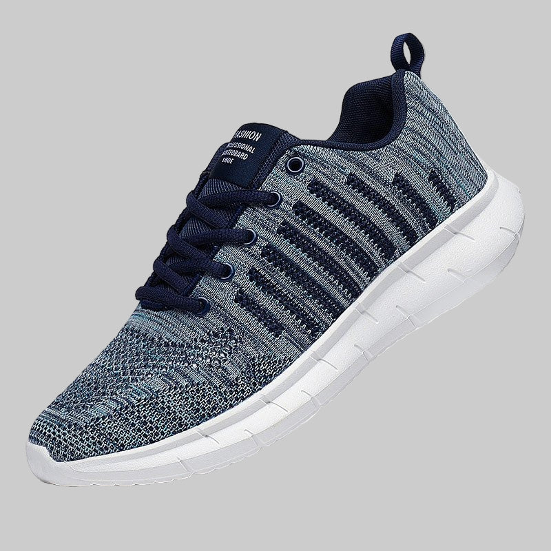 Gray and navy sneaker with white sole on a white background