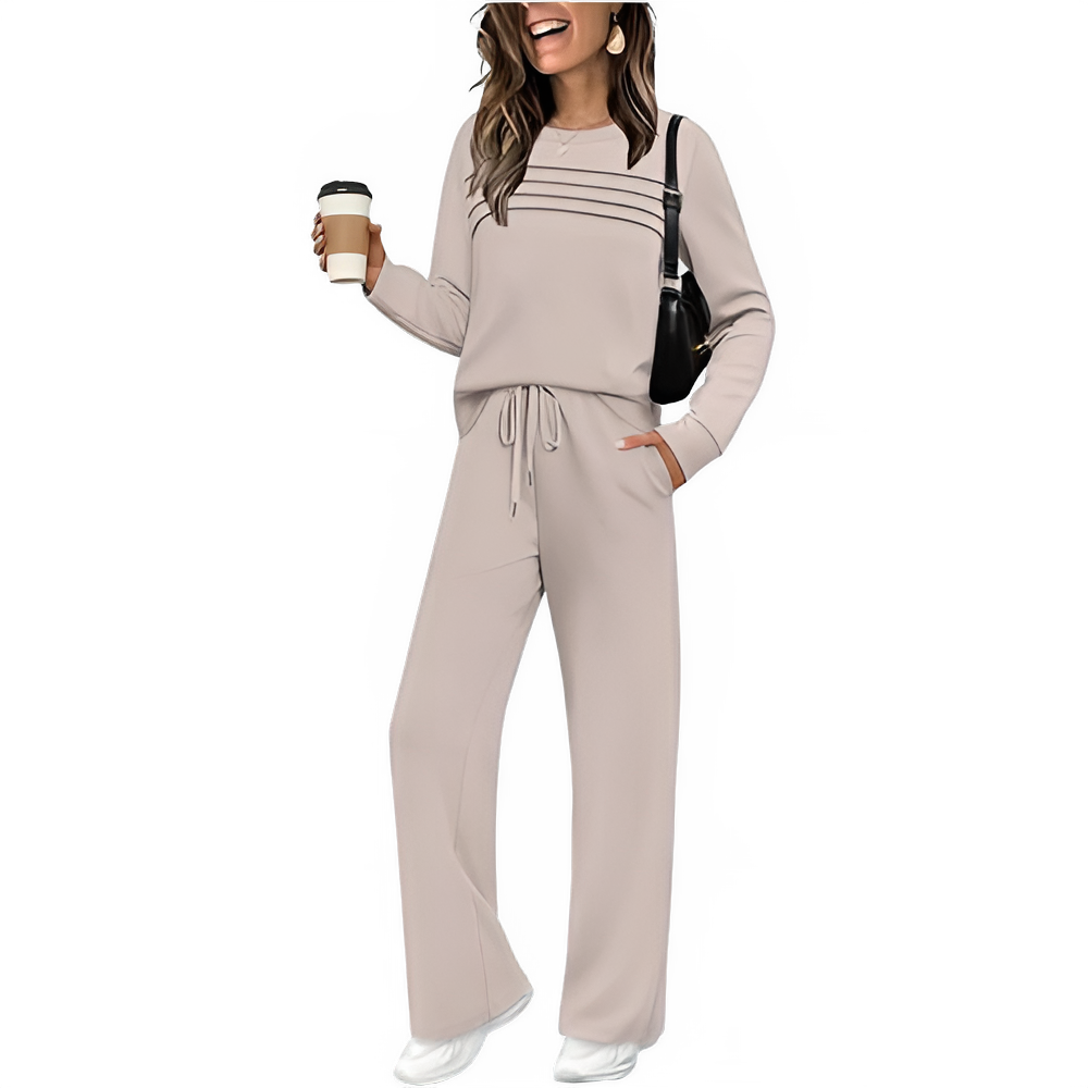 Woman wearing a beige lounge set holding a coffee cup on a white background