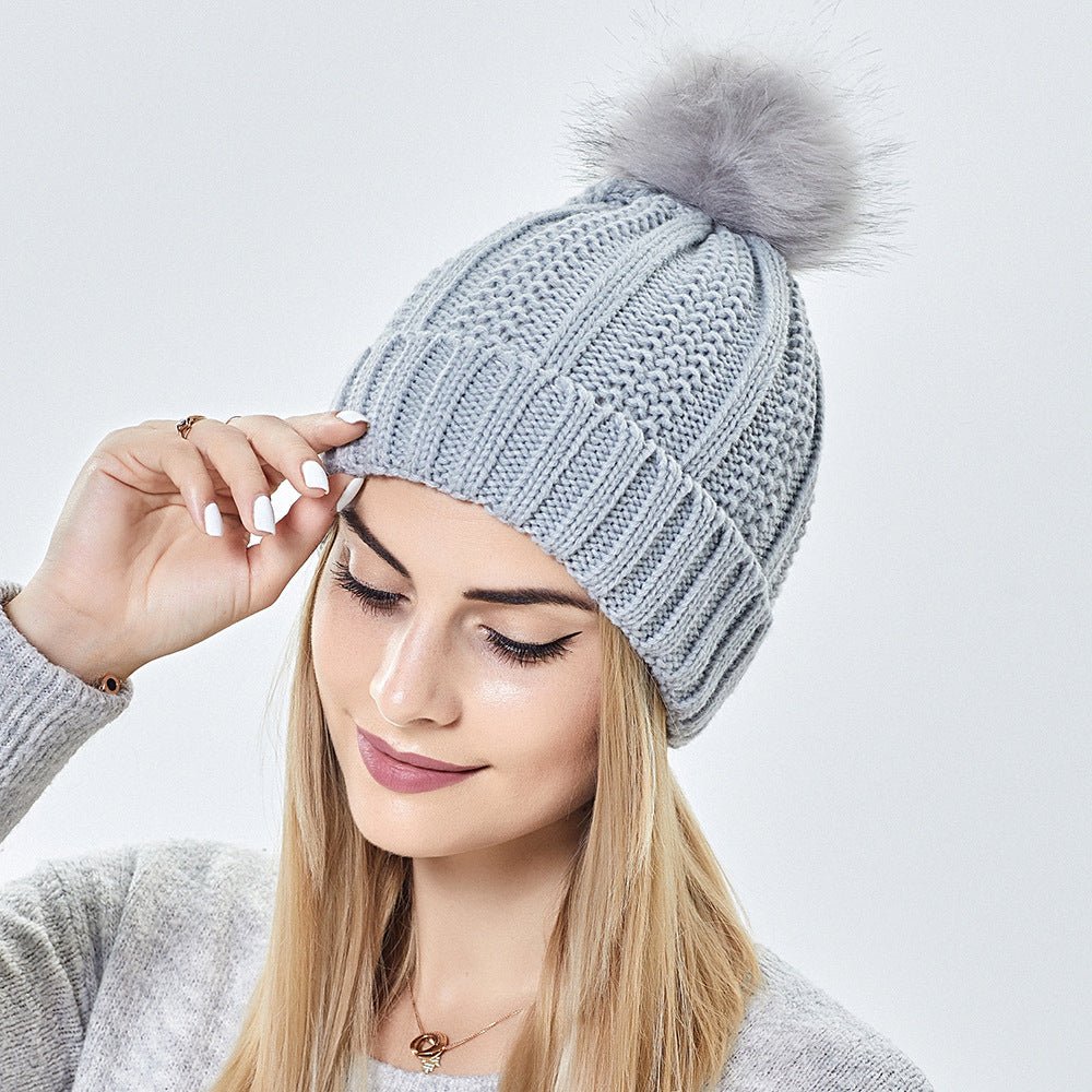 Ensure all product images have descriptive alt text, such as "Women's satin-lined knit beanie with faux fur pom