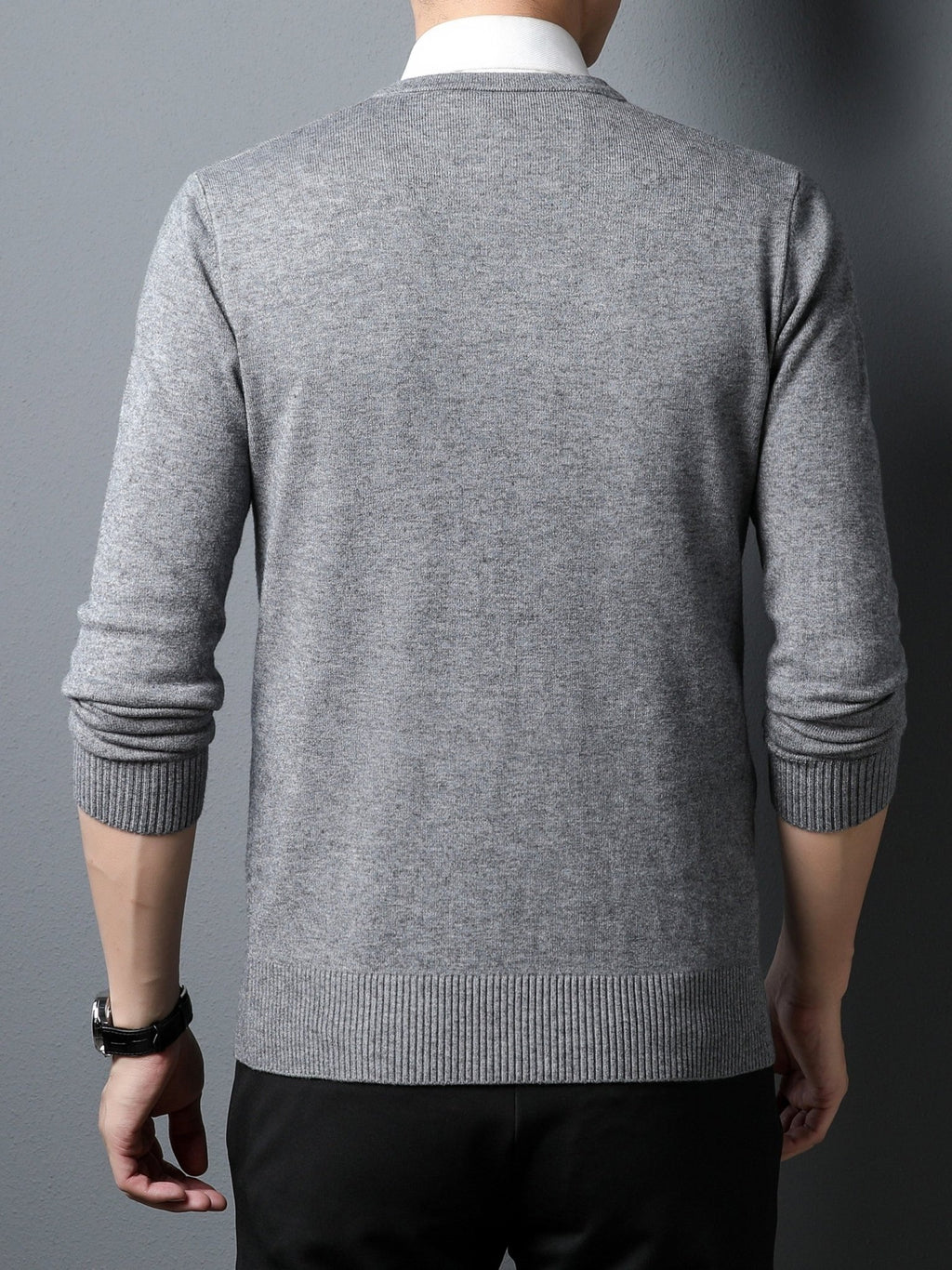 Gray Men's Knitted V-neck Sweater worn by a person on a dark background
