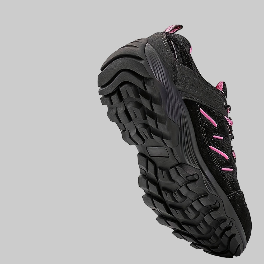 Black and pink women’s non-slip hiking shoes with multi-terrain traction system features on a white background