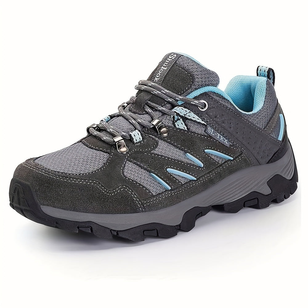 Gray women’s non-slip hiking shoes with blue accents on a white background