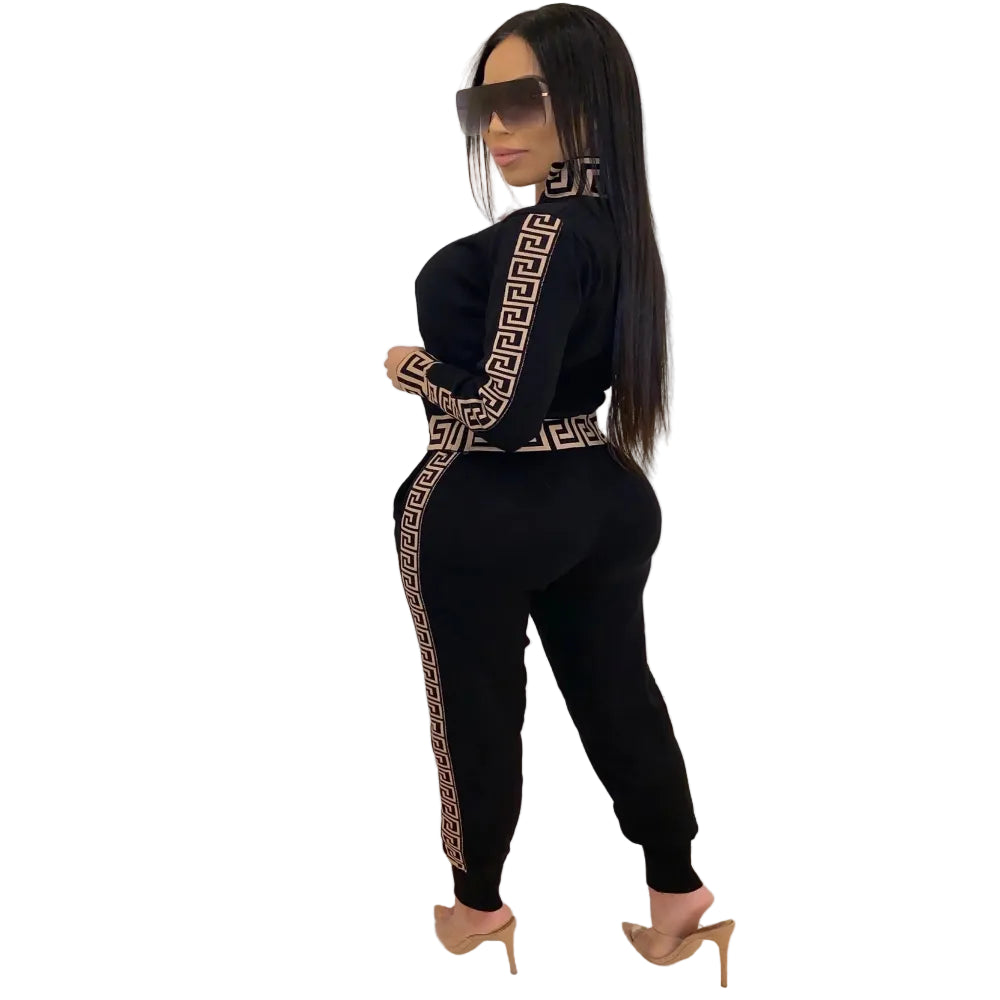Women’s Zip-Up Tracksuit Set outfit with geometric patterns against a white wall