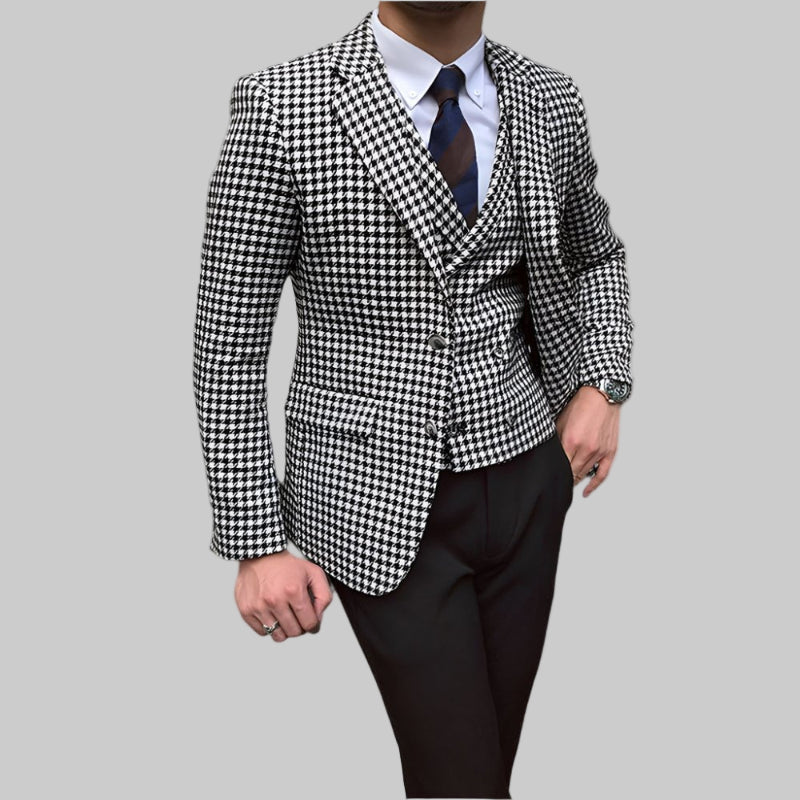 Black and white checkered suit jacket with a vest and pants on a white background