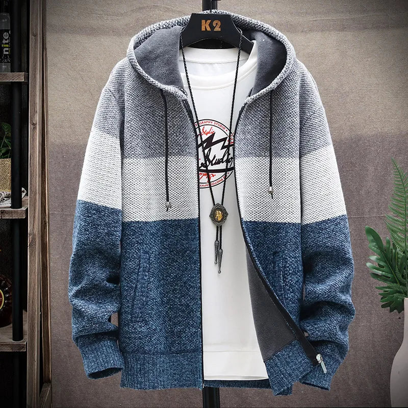 Blue and gray striped hoodie on a hanger with a white shirt underneath.