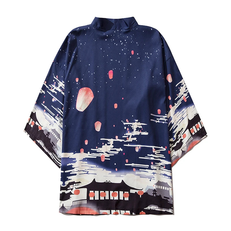 Navy blue poncho with Japanese-themed design featuring hot air balloons and traditional architecture on a white background.