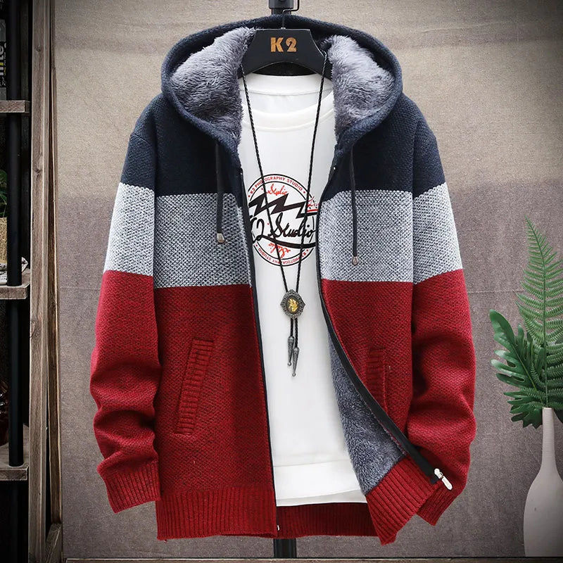 Color-blocked hoodie with red, gray, and navy sections on a hanger.