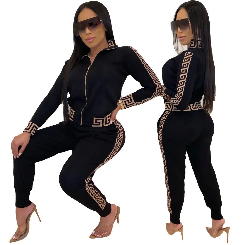 Women’s Zip-Up Tracksuit Set outfit with gold patterns, sitting and standing on a white background.