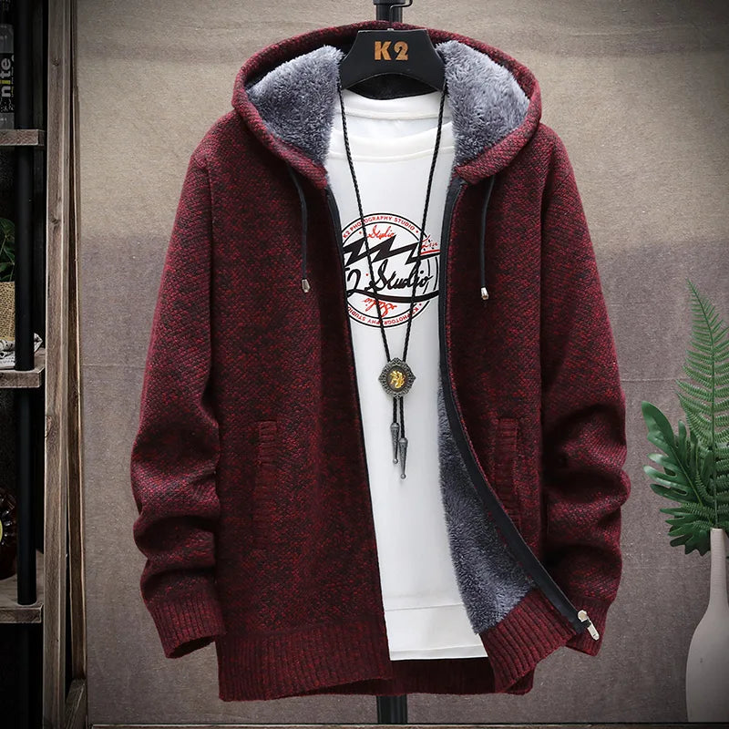 Maroon hoodie with gray lining on a hanger against a neutral background
