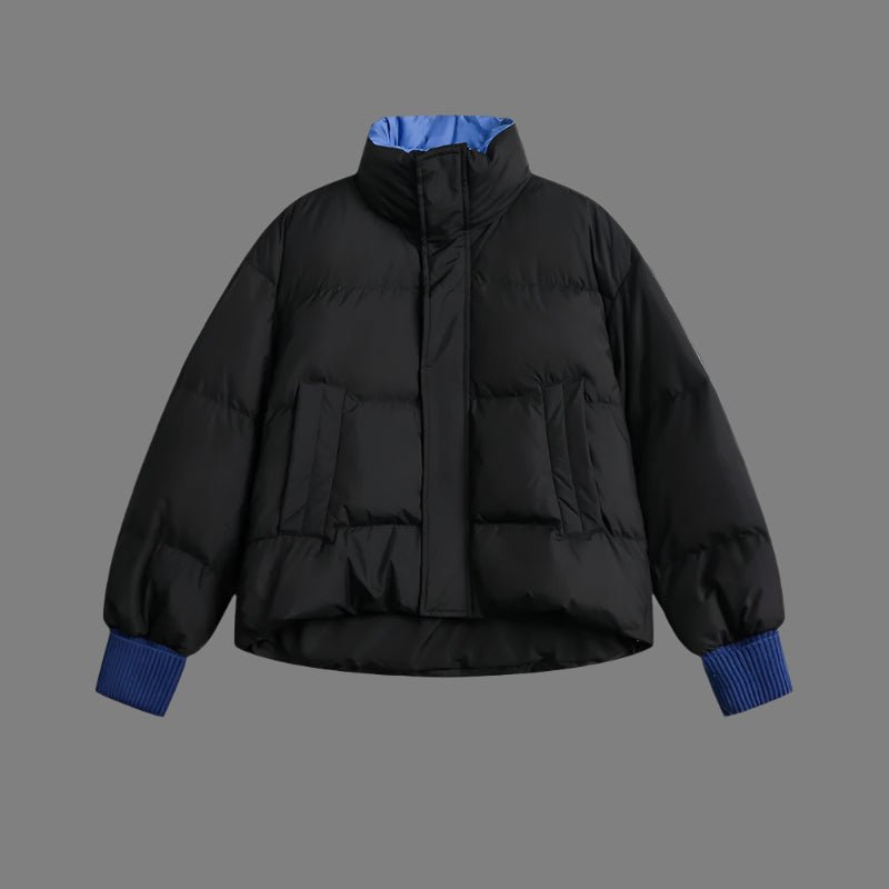 Woman wearing a lightweight puffer jacket in a slim, stylish fit for cold weather.