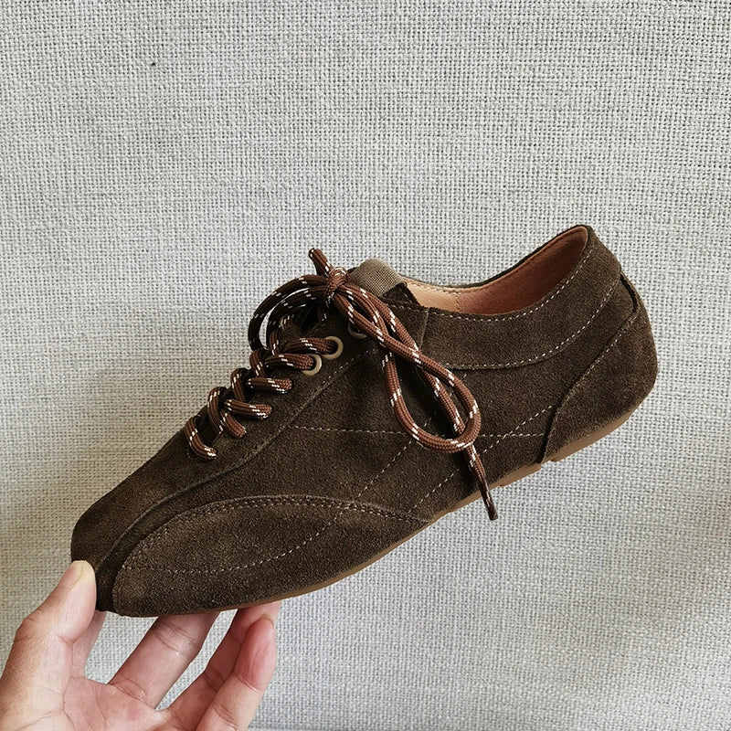 Women's dark brown suede platform sneakers with cross-tied design