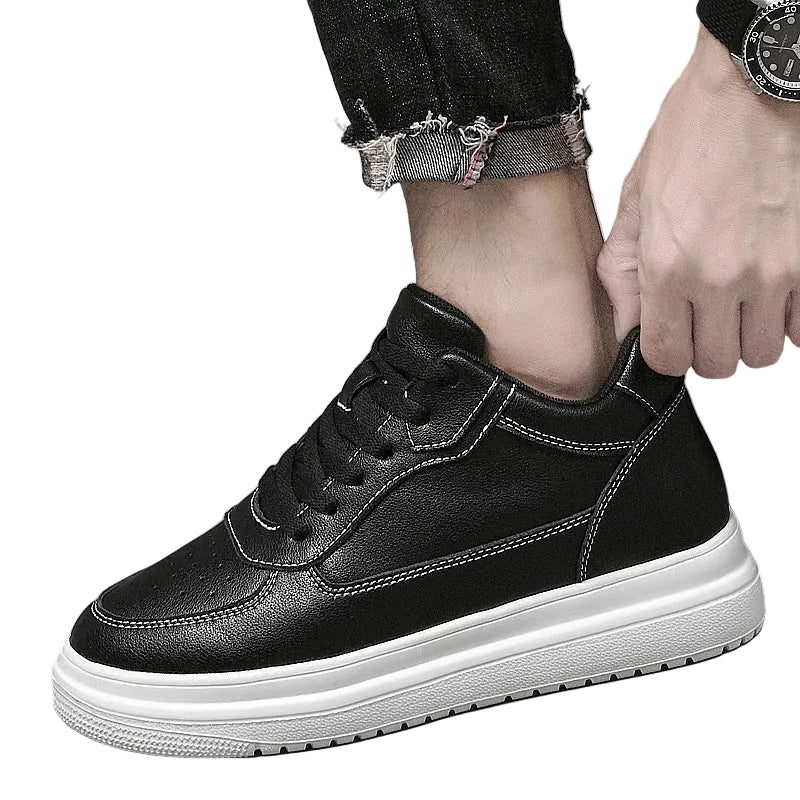Men's Elevator Sneakers, Black Color with white sole worn by a person.