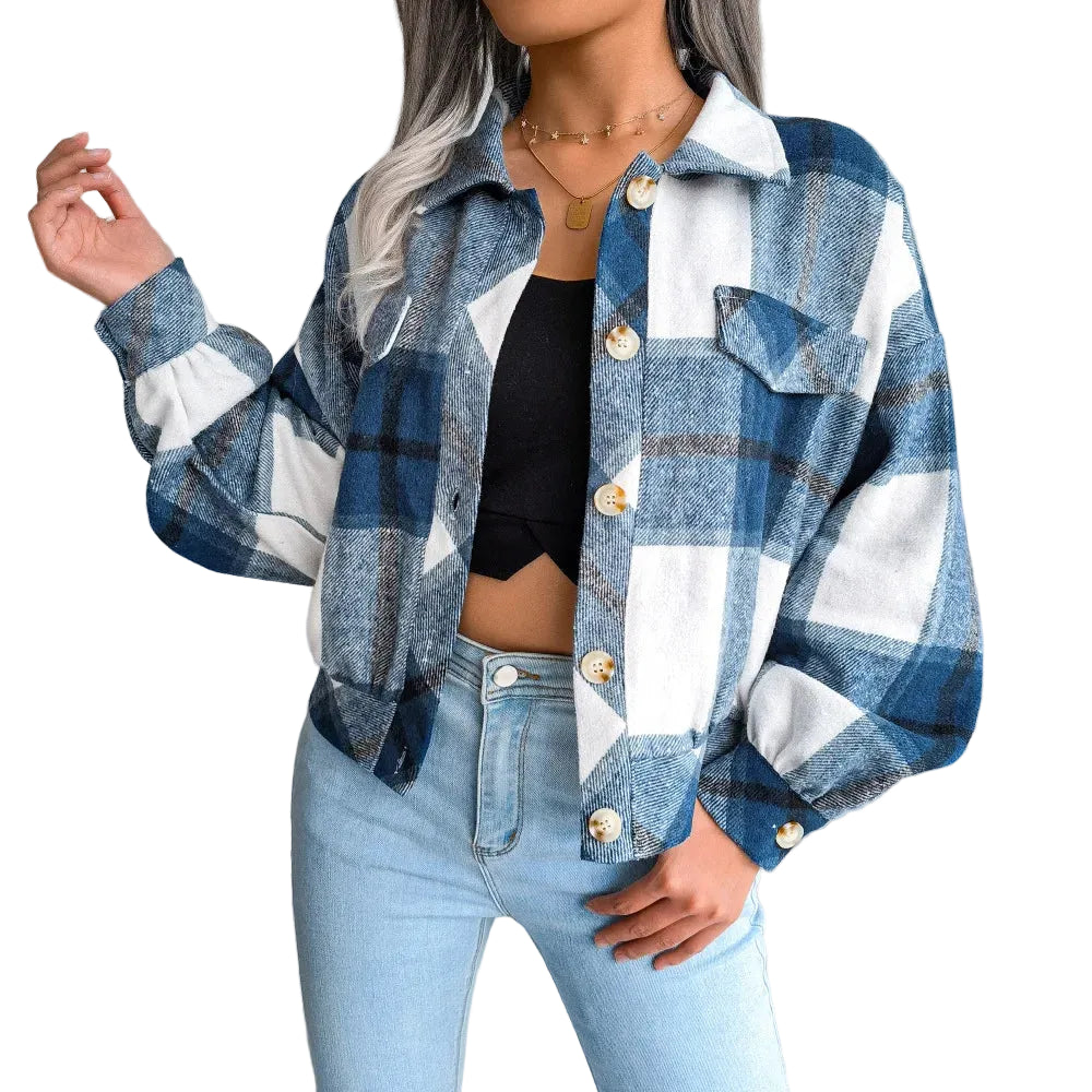 Person wearing a blue and white plaid shirt with a blurred background