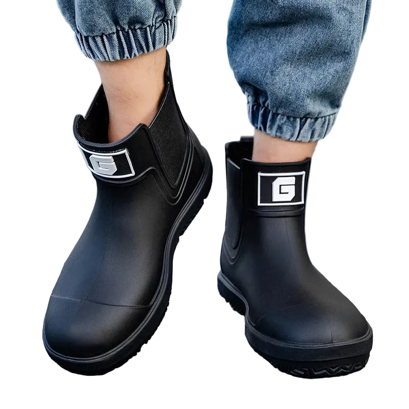 Urban Rain Defender boots – pair on ground, outdoor setting
