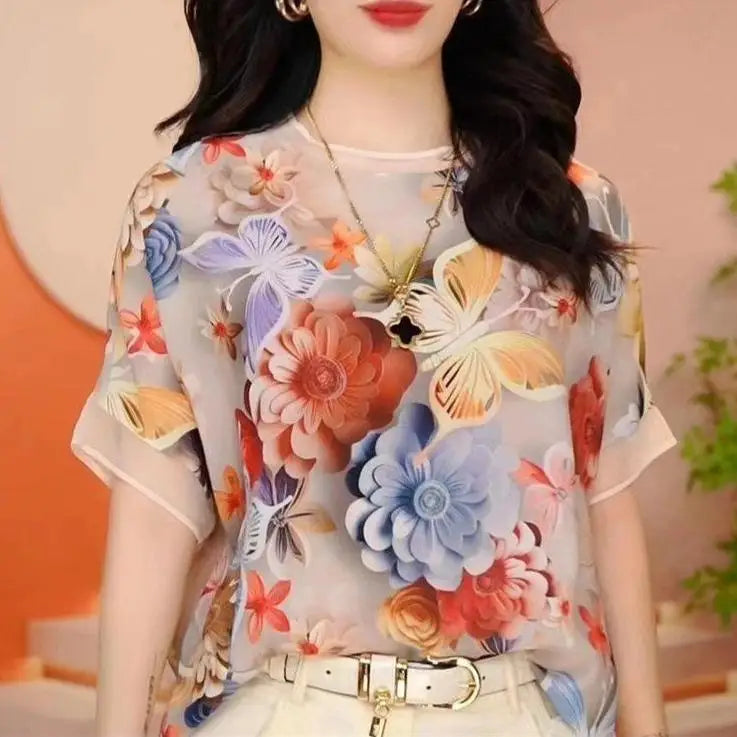 Woman wearing a floral blouse with a blurred background