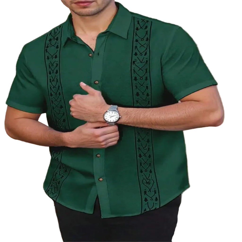 Man wearing a green embroidered guayabera shirt.