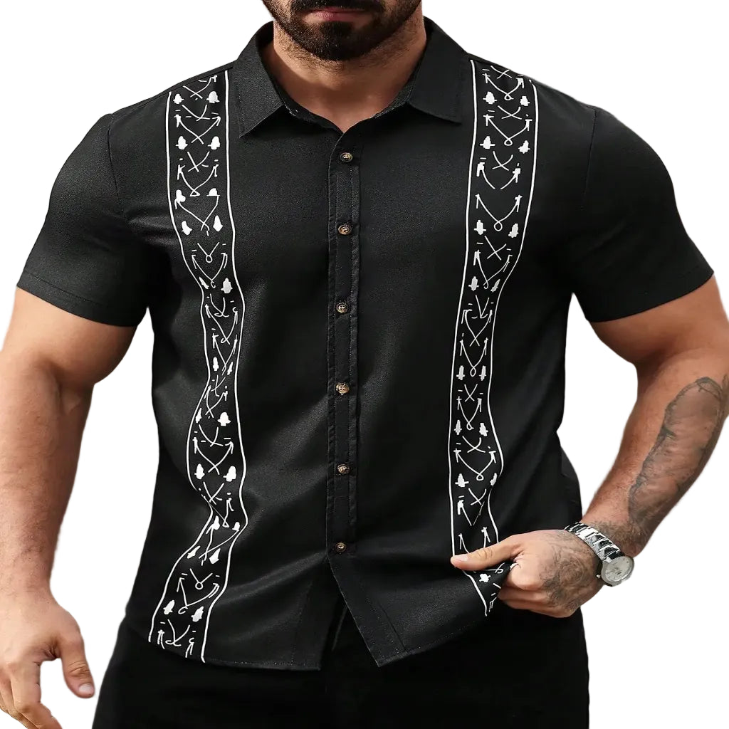 Man wearing a black guayabera shirt with white embroidery.