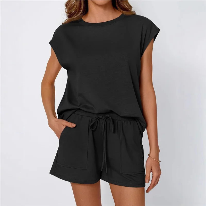 Black romper worn by a person on a white background