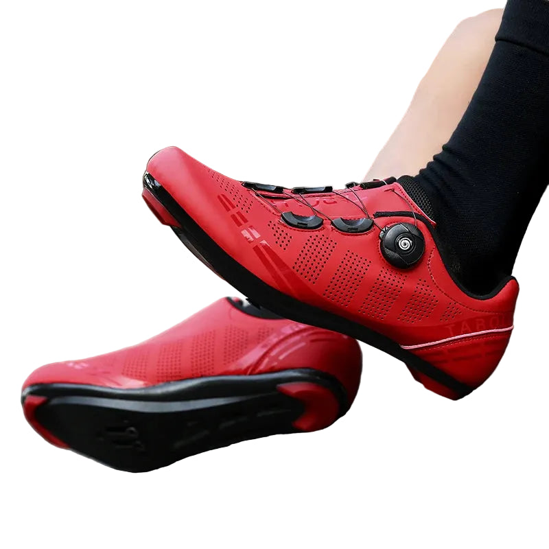 Red cycling shoes on a road with a blurred background
