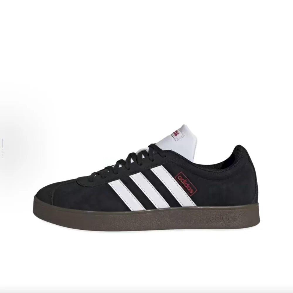 Black Retro Low Top Sneakers with white stripes on a white background