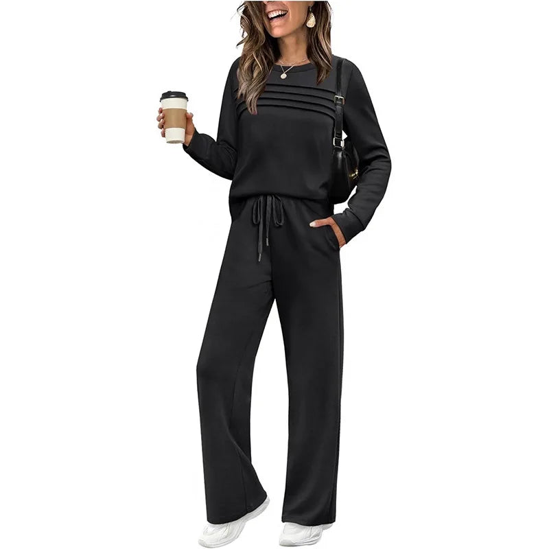 Woman wearing a black outfit holding a coffee cup on a white background