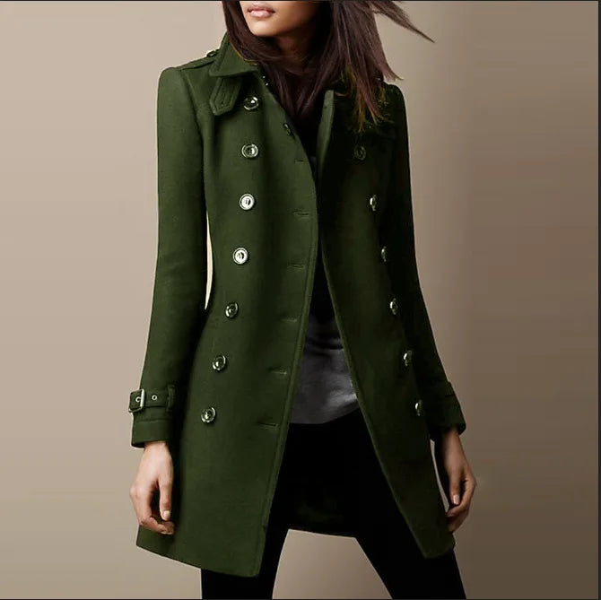 Green coat worn by a person on a plain background