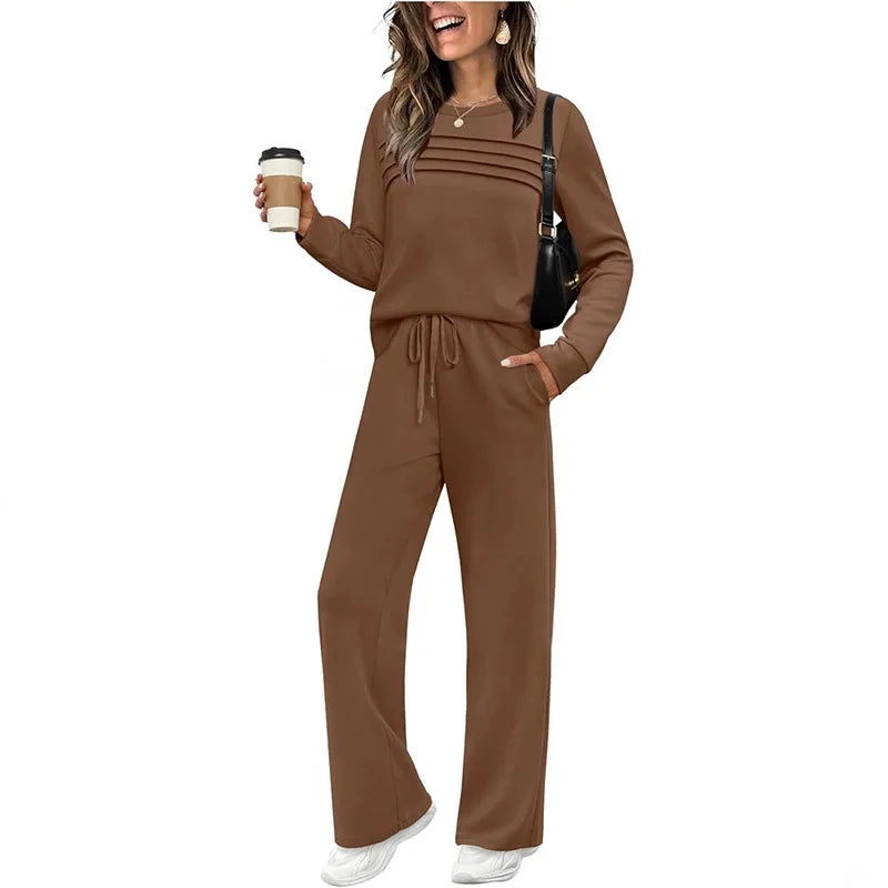 Woman wearing a gray matching set with a coffee cup on a white background