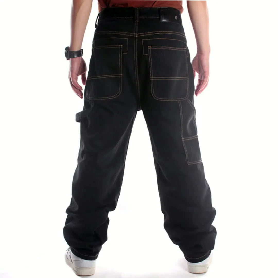 Black cargo pants worn by a person on a white background
