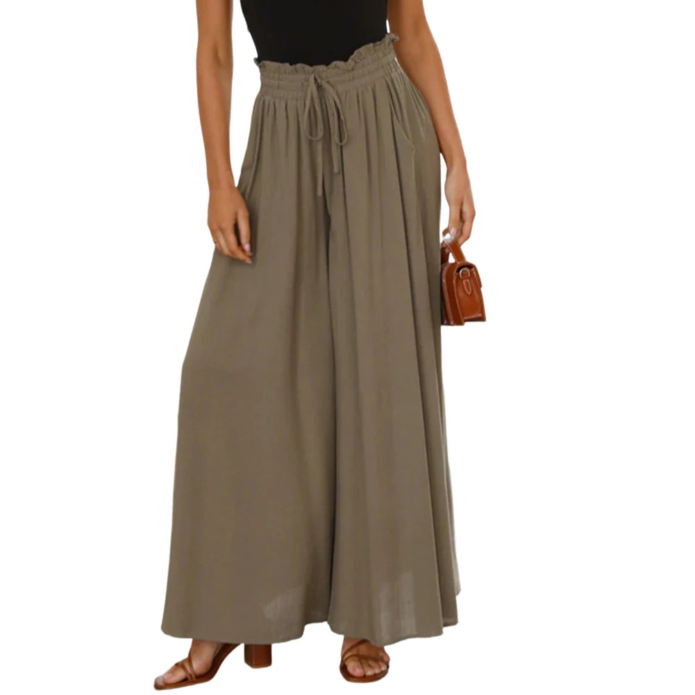 Woman wearing a long beige skirt on a white background