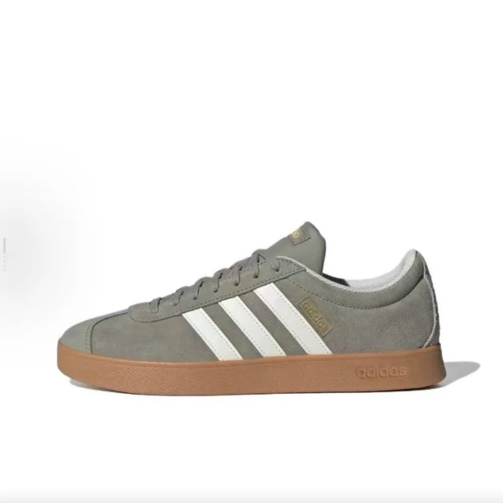 Green Retro Low Top Sneakers  with white stripes on a white background