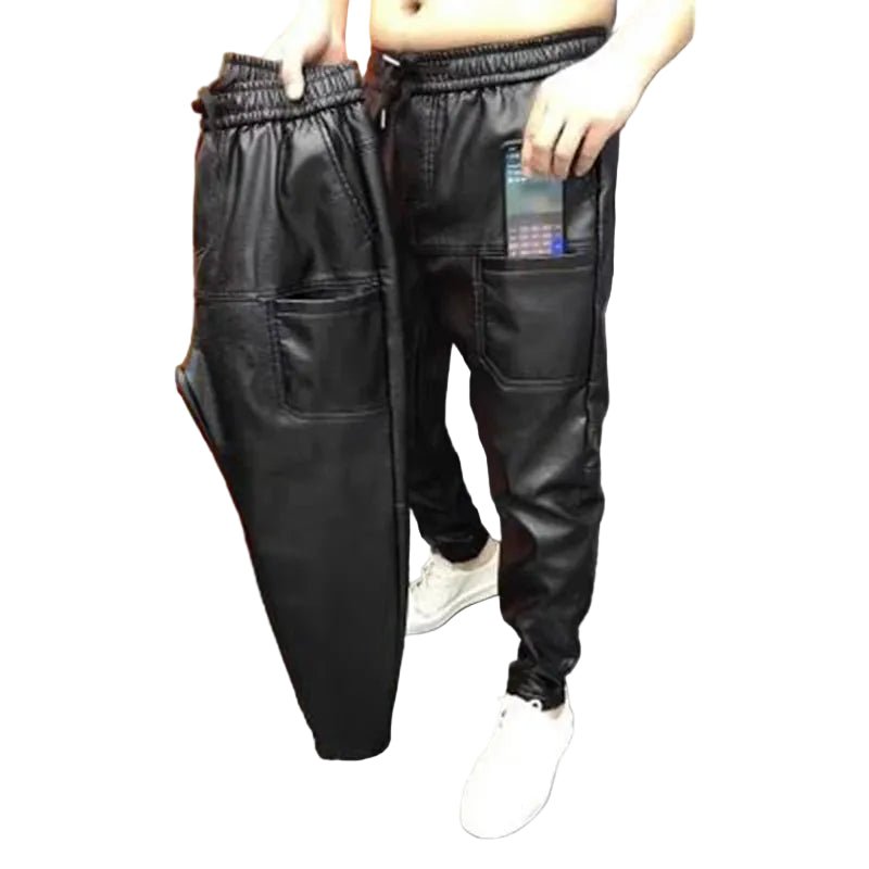 Black leather jogger pants worn by a person on a white background