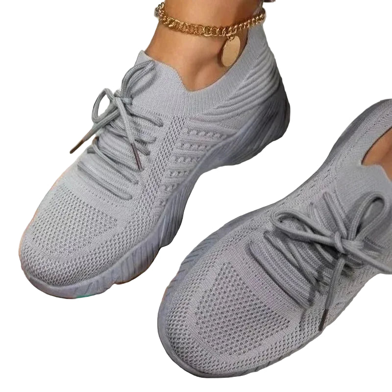 Women's gray mesh sneakers with matching laces and textured soles at Casual Flow Shop
