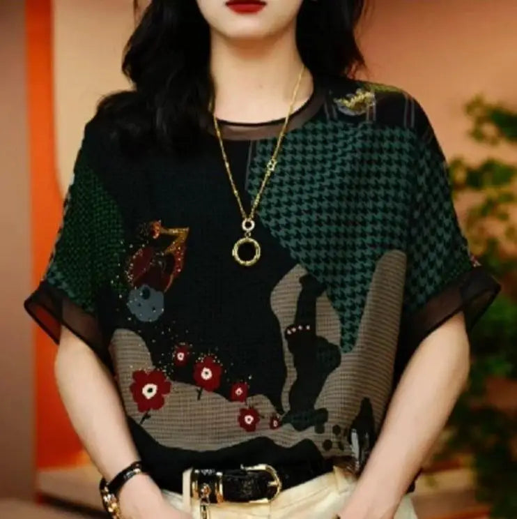 Woman wearing a patterned top with a blurred background