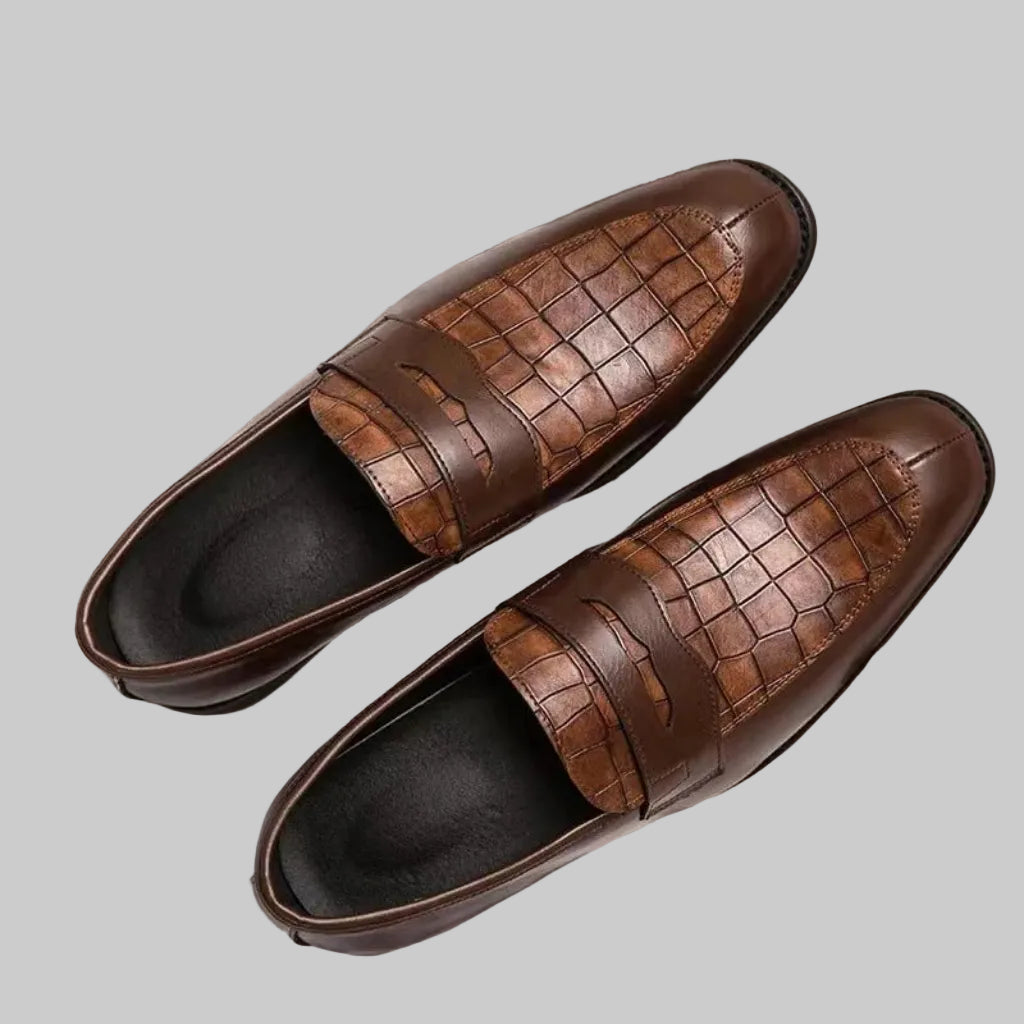 Luxury men’s British crocodile loafers in brown leather, top view